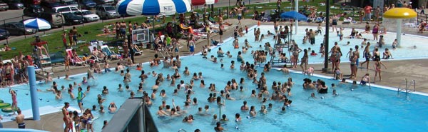 A view from the top of the slide shows hundreds of swimmers