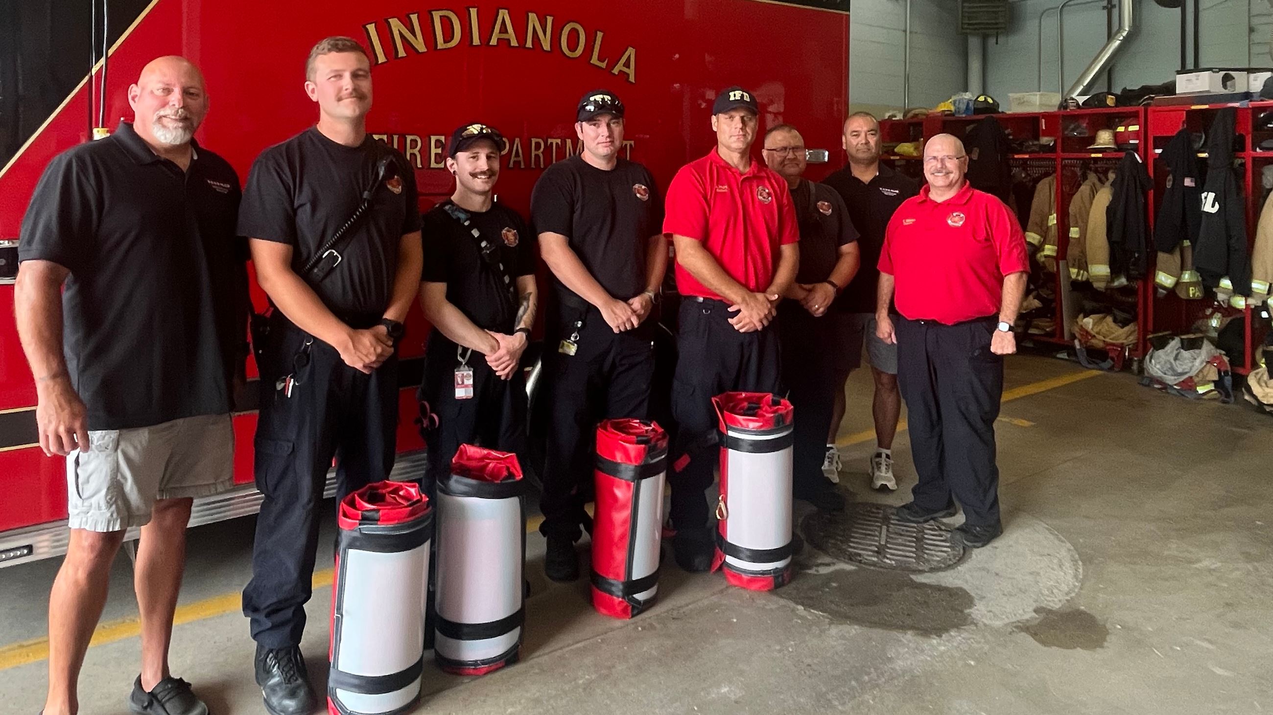 Indianola Fire Department poses for a photo with newly-acquired REDD sleds.