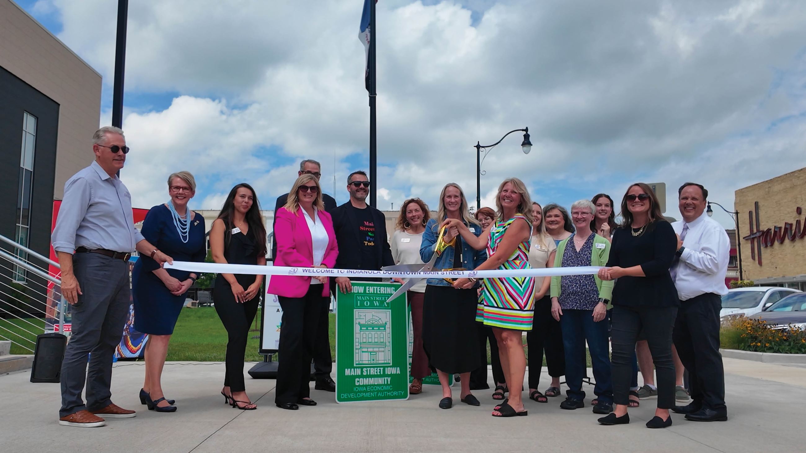 Indianola and community leaders pose for a photo at the Indianola Downtown Main Street event