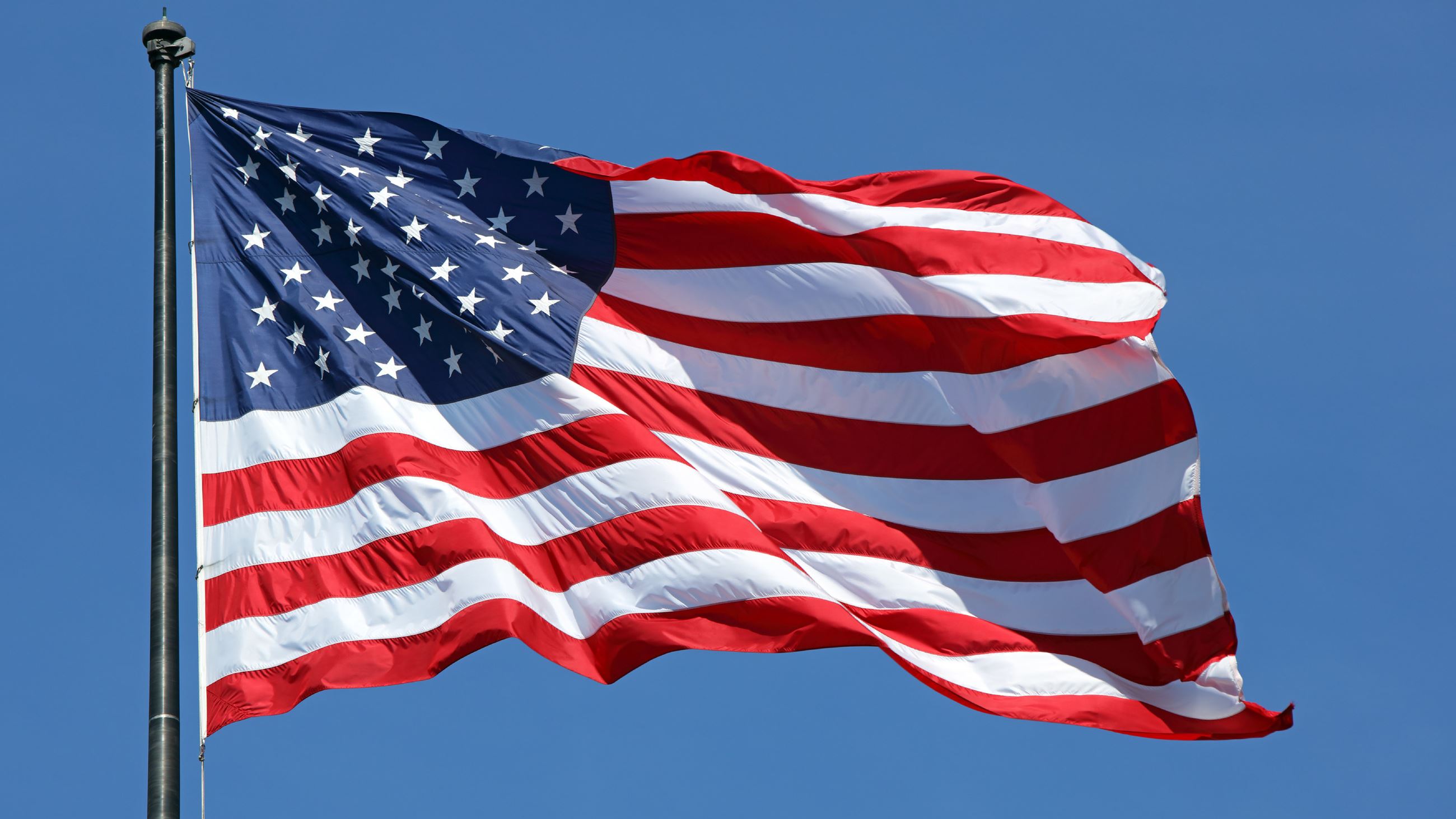 American flag waving in the sky.
