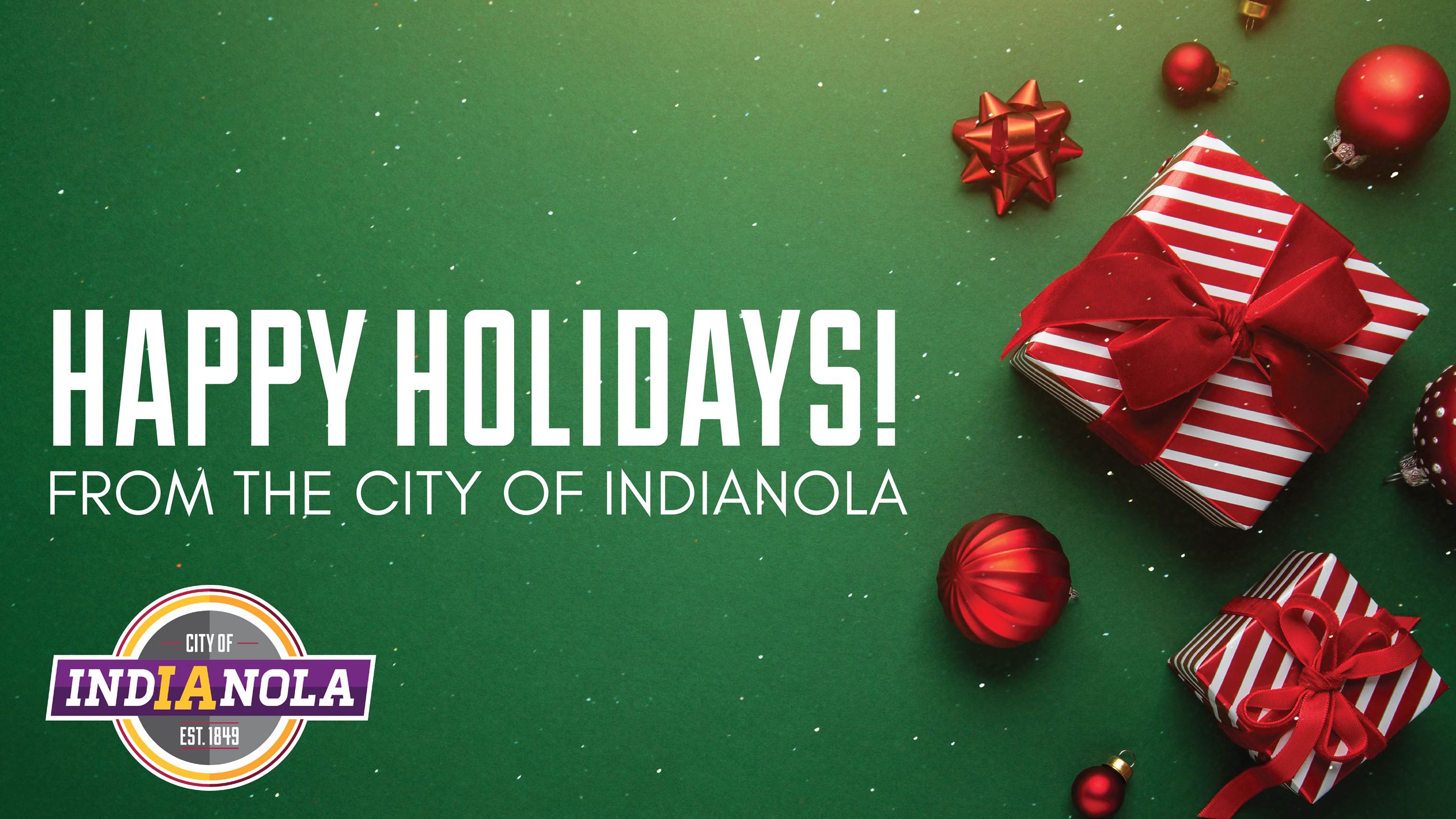 Red and white presents in front of a green background with text that reads Happy Holidays