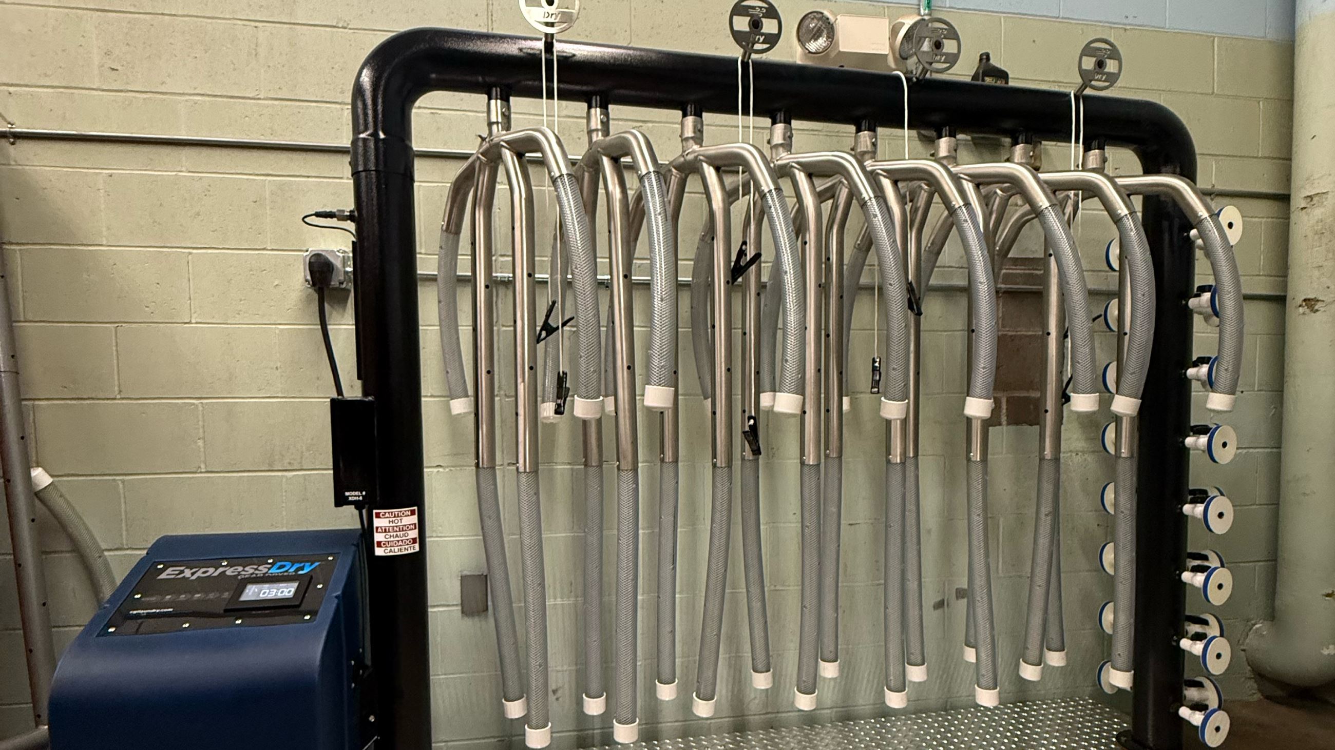 Silver and blue parts of a turnout gear dryer recently obtained by Indianola Fire.