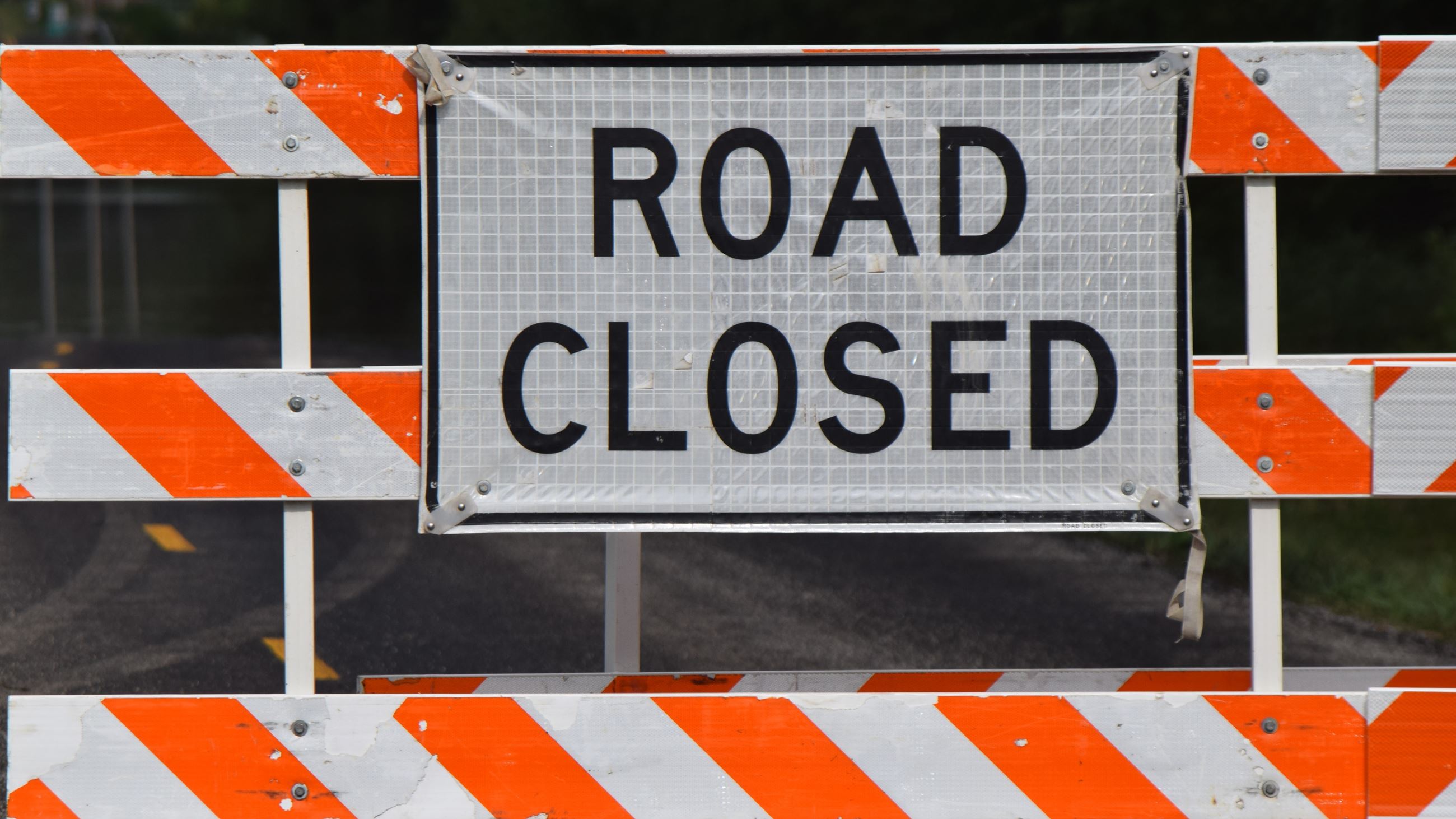 An orange and white barricade with a 