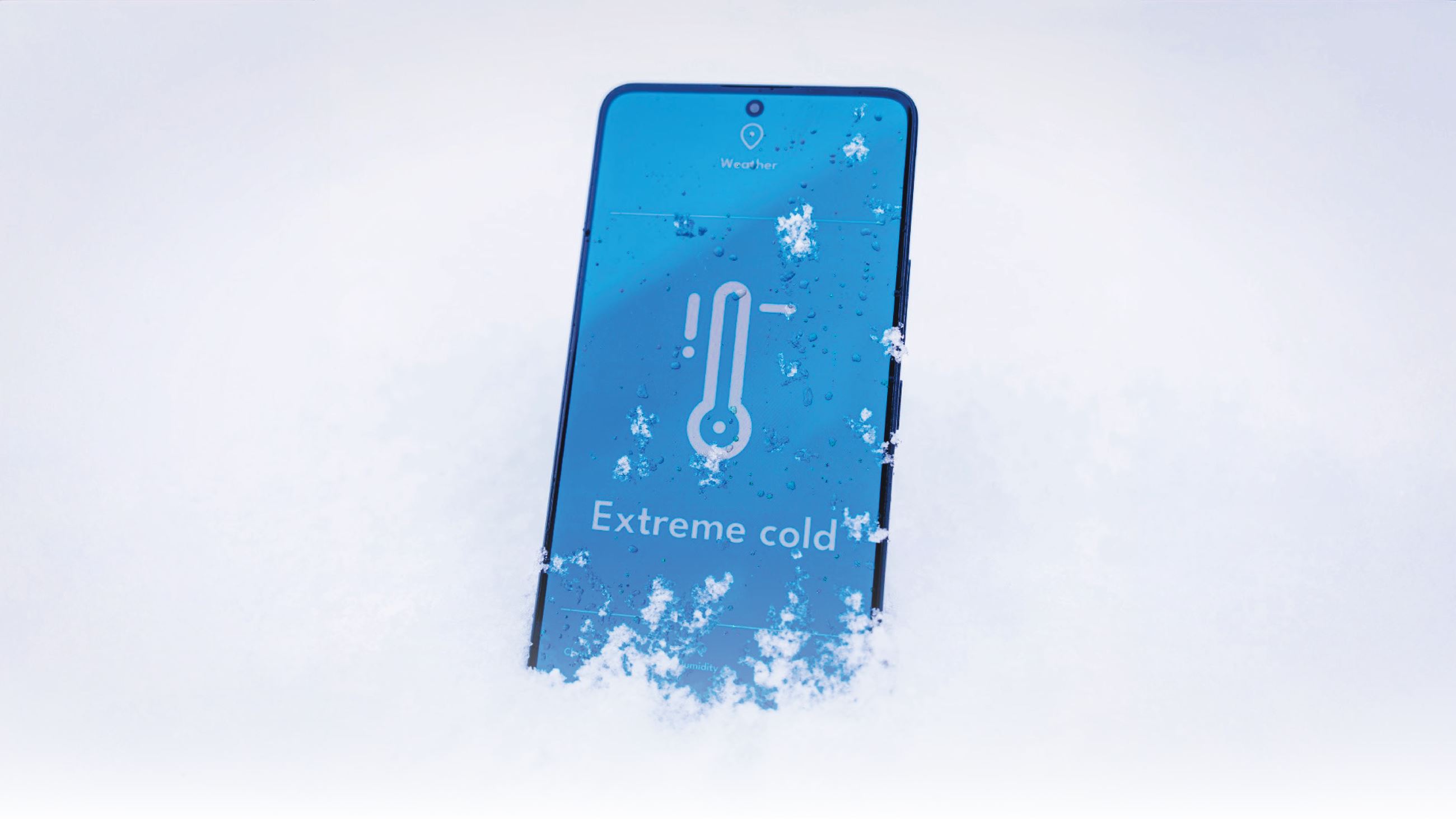 A smartphone with a blue screen that says Extreme Cold surrounded by snowfall.