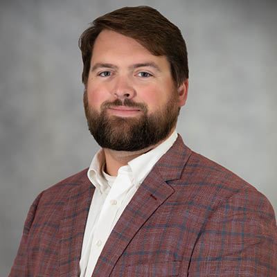 Community & Economic Development Director Bryce Johnson smiles for a portrait photo.