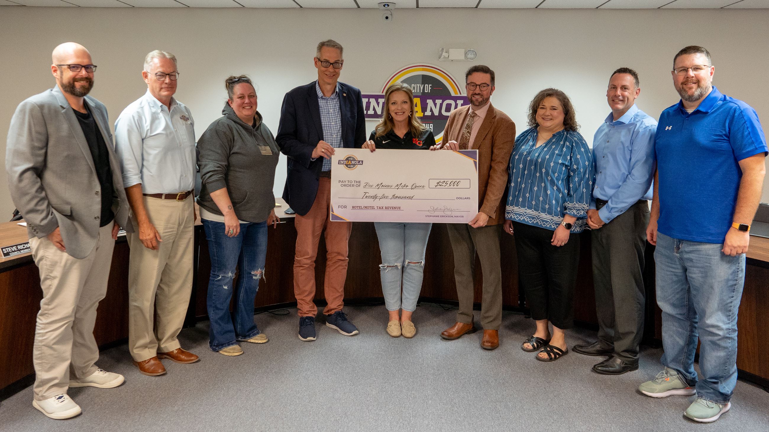 Indianola City Council presents a $25,000 check to the Des Moines Metro Opera on Sept. 16, 2024.