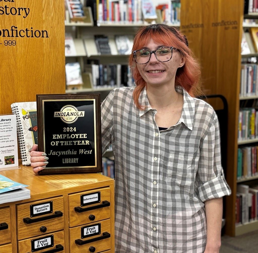 Jacy West, Adult Services Librarian, poses for a photo after being named 2024 Employee of Year.