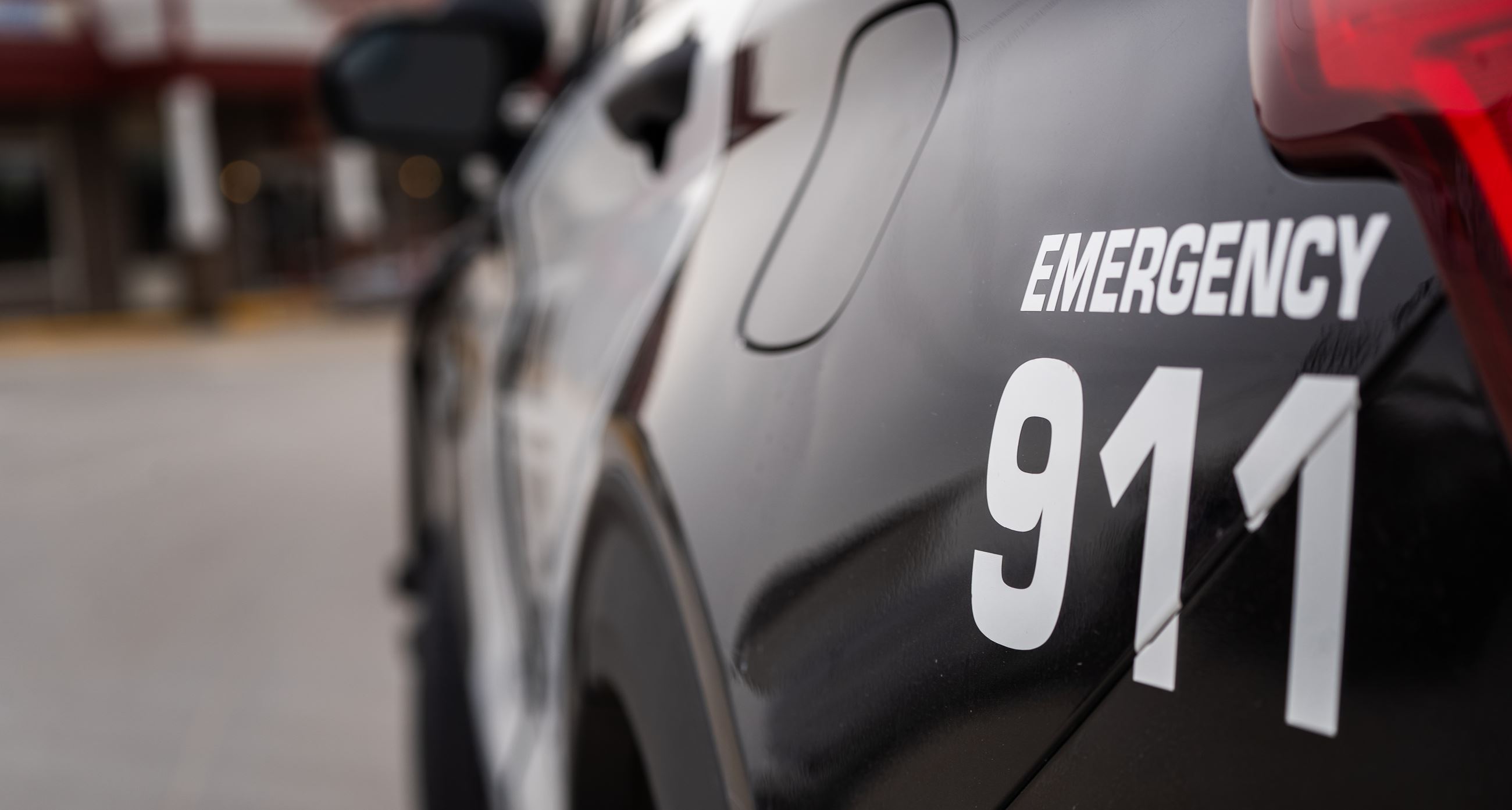 An Indianola Police Department vehicle is parked outside a building.