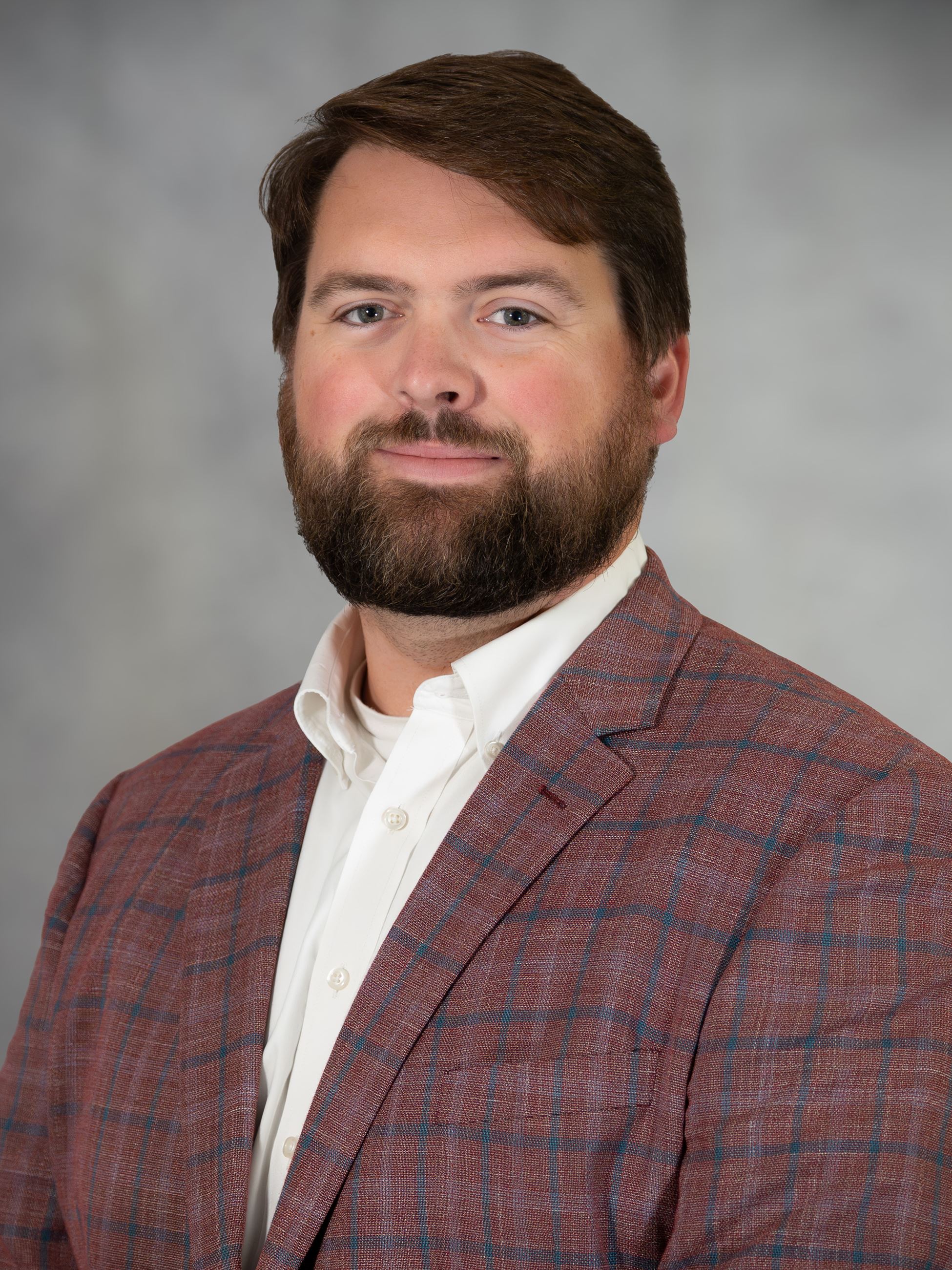 A portrait photo of Indianola Community and Economic Development Director Bryce Johnson